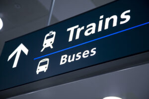 train and bus directional signs in airport