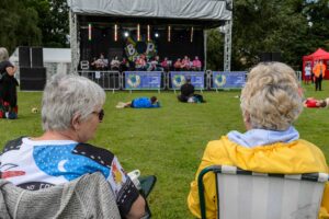 ladies sitting infront of bop fest stage