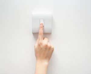 person turning off light
