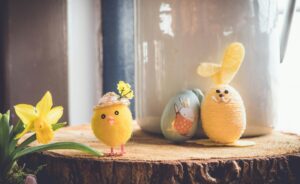 Easter image with a handmade chick and bunny egg and daffodil