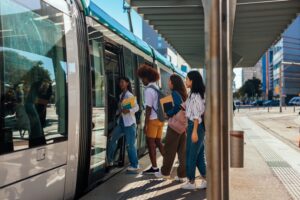 people getting on a tram