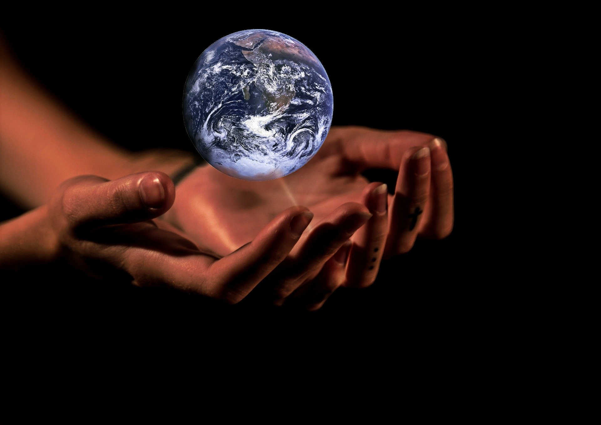 Hands holding earth