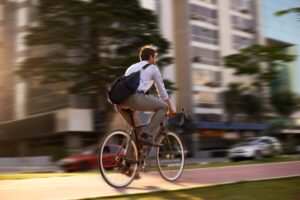 man cycling on street